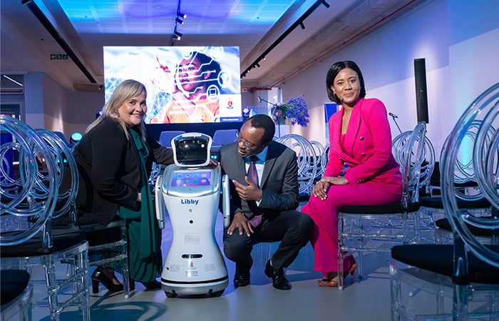 Prof Natasja Holtzhausen of UP’s Faculty of Economic and Management Sciences and the Director of the Centre for the Future of Work; Libby, the robotic library assistant; UP Vice-Chancellor Prof Tawana Kupe; and Dr Olebogeng Selebi, Deputy Director of the Centre.