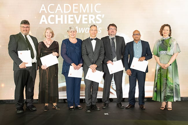  A group of UP academics pose with awards at Academic Achievers Awards ceremony
