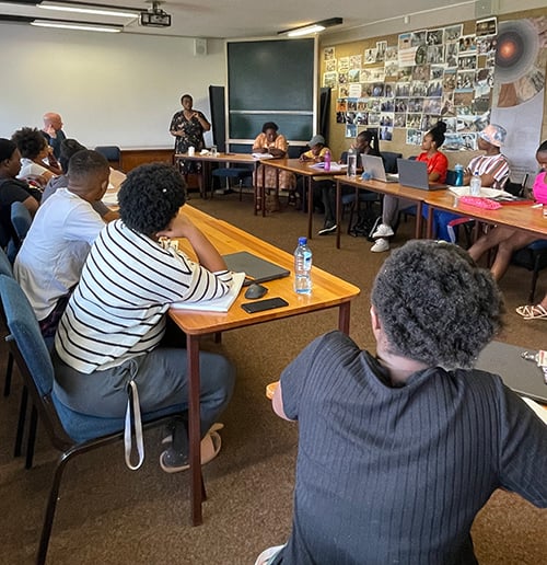 Activist Rose Molokoane talking to a small group of UP students.