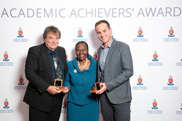 Recipients of the Chancellor’s Award Professor Nigel Bennett (left) and Professor De Wet Swanepoel (right) with UP's Chancellor Emeritus Justice Sisi Khampepe (centre).