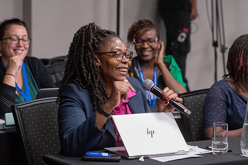 Seminar attendees participating in a question-and-answer session