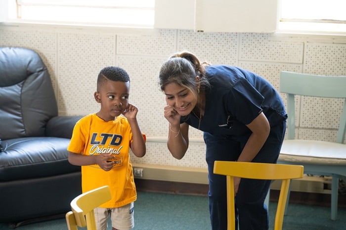 Final year student, Zeneera Bahadoor, builds her young client's listening skills to support his language development