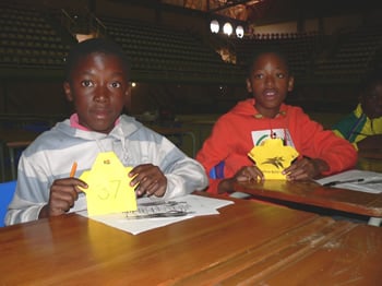 learners from Bajabulile Primary School with their origami paper soccer shirts